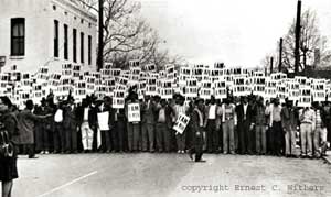 Memphis sanitation workers' strike/march under "I Am A Man" picket signs, Memphis, TN, March 29, 1968. (Ernest C. Withers via http://workers.org). 