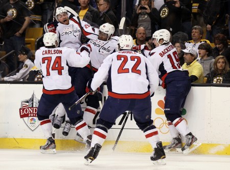 Joel Ward in celebration with Washington Capitals teammates after scoring game/series winning goal in Round 1 of Stanley Cup Playoffs against Boston Bruins (all while fans chanted racial slurs), April 26, 2012. (http://www.flightunit.com/).