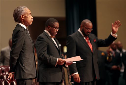 Rev. Al Sharpton waiting to speak at Michael Brown funeral, Friendly Temple Missionary Baptist Church, St. Louis, MO, August 25, 2014. (AP Photo/St. Louis Post Dispatch, Robert Cohen, via http://www.wkbn.com).