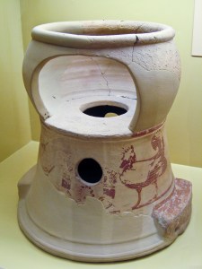 Ancient Greek child seat and chamber pot, early 6th century BCE, Agora Museum, Athens, March 14, 2009. (Sharon Mollerus via Flickr/Wikipedia). Released to public domain.