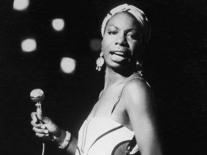 Nina Simone performs at a concert in 1964. (http://npr.org, via Hulton Archive/Stringer/Getty Images).