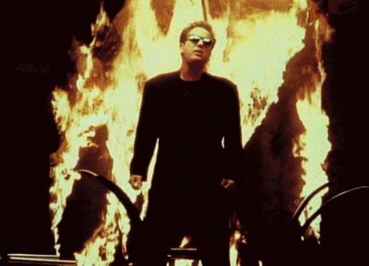 Billy Joel, "We Didn't Start The Fire" (video screen shot), 1989. (http://denverlibrary.org/).