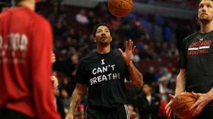 Chicago Bulls guard Derrick Rose in pre-game warm-ups, dressed in his "I Can't Breathe" protest shirt, United Center, Chicago, December 6, 2014. (http://chicagotribune.com).