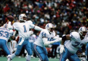 Hall-of-Fame QB Warren Moon with Houston Oilers, throwing from within pocket on his 527-yd passing day against the Kansas City Chiefs, December 16, 1990. (http://spokeo.com).