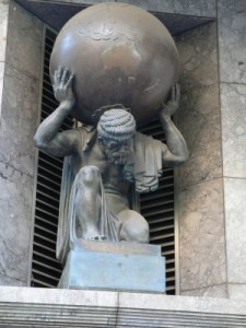 Atlas supports the terrestrial globe on a building in Collins Street, Melbourne, Australia, October 9, 2006. (Biatch via Wikipedia). Released to the public domain.