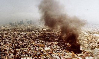 Overhead shot of L.A. riots, contrast between South Central LA fires and downtown LA smog, April 30, 1992. (http://latimes.com).