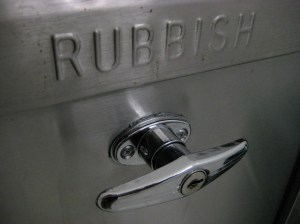 Standard New York-area garbage chute door, June 2009. (http://theferrisfiles.com/).