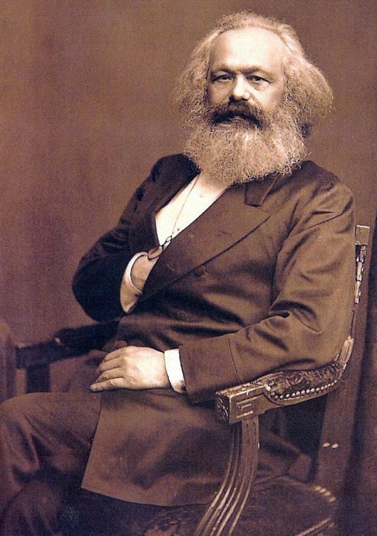A portrait of Karl Marx, age 57, approximately August 24, 1875, by John Jabez Edwin Mayall, International Institute of Social History, Amsterdam. (Quibik via Wikipedia). In public domain.