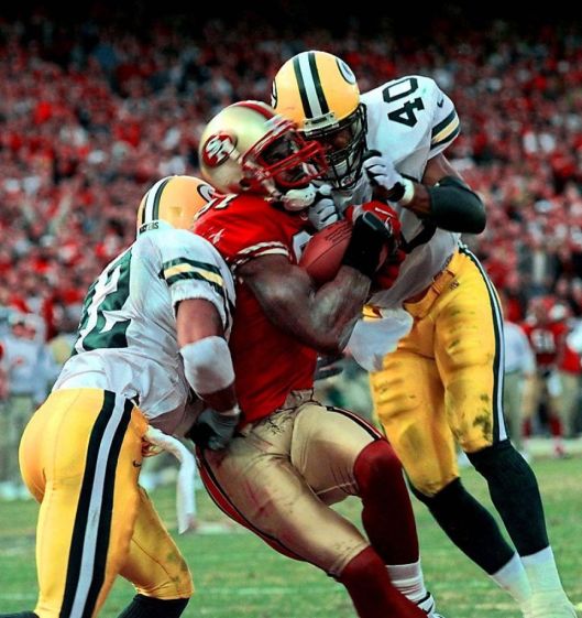 Maybe not a HOF, but a great crunch time catch (literal and figurative) by Terrell Owens, San Francisco 49ers vs. Green Bay Packers, Wildcard Game, Candlestick Park, January 3, 1999. (http://sfgate.com).