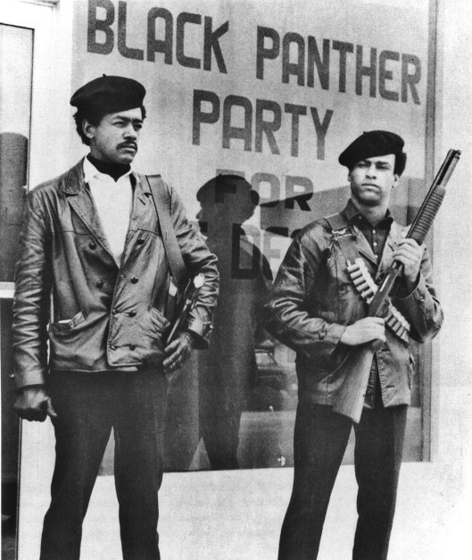 Black Panther national chairman Bobby Seale, wearing a Colt .45 and defense minister Huey Newton with a bandolier and shotgun, poster, Oakland, CA, 1968. (AP via http://pbs.org).
