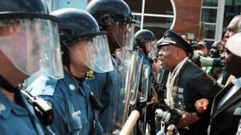 Militarized St. Louis County Police and protesters standoff, Ferguson, MO, September 10, 2014. (Robert Cohen, St. Louis Post-Dispatch/AP via http://motherjones.com).