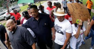 Rev. Jesse Jackson with group of protesters, Ferguson, MO, August 15, 2014. (http://www.cbsnews.com).